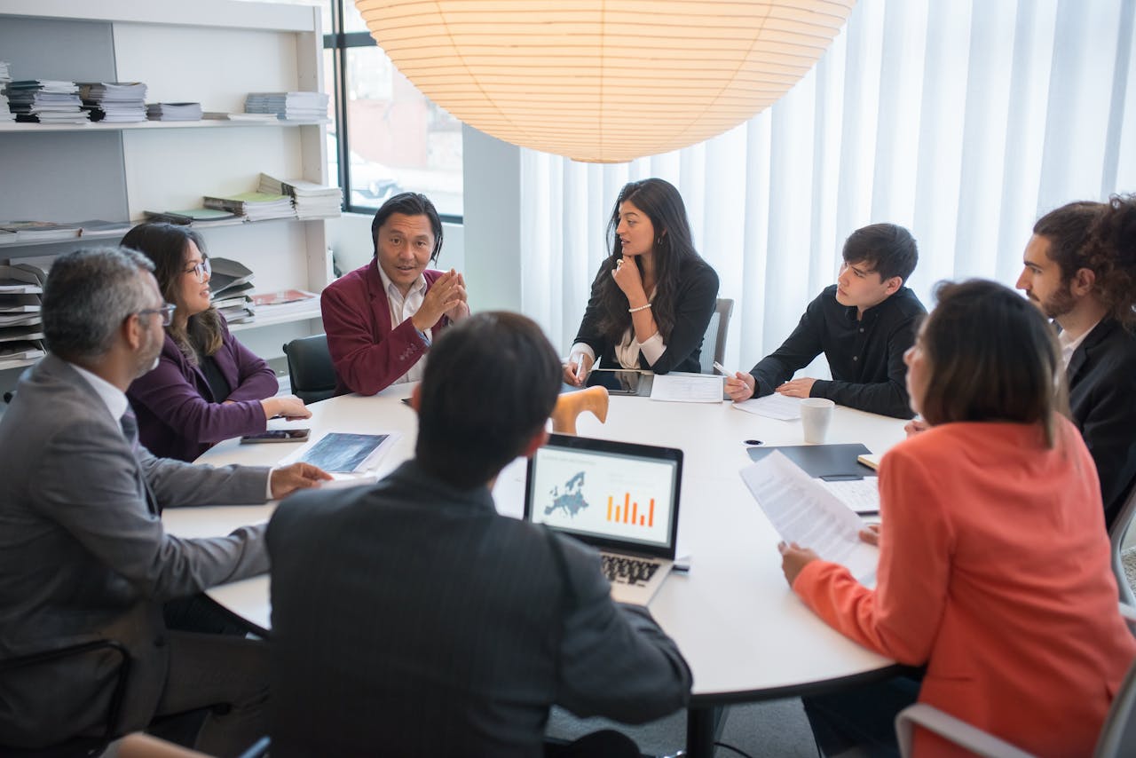 A diverse group of professionals collaborating in a modern conference room.